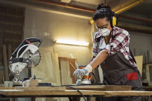Woman sanding wood