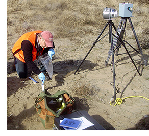 Image of worker taking a sample